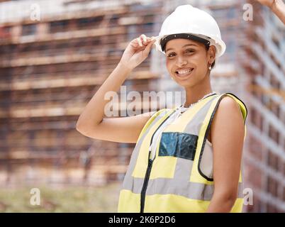 Building, construction site and architect portrait of woman in engineering. Engineer, architecture and construction worker in safety gear to check Stock Photo