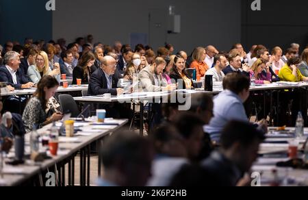 Villingen Schwenningen, Germany. 15th Oct, 2022. Party members watch a speech by CDU state chairman Strobl during the state party conference of the CDU Baden-Württemberg at the exhibition center. Credit: Silas Stein/dpa/Alamy Live News Stock Photo