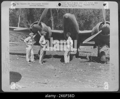 This twin-engine Japanese fighter plane of the 'Nick' class was found wrecked on Palawan when the U.S. troops invaded the island. Technicians of the 13th AAF service squadron made it fit to fly by salvaging parts from other aircraft damaged by the Stock Photo