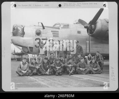 Crew Members Of The 458Th Bomb Group Pose Beside A Consolidated B-24 At An 8Th Air Force Base Somewhere In England. Stock Photo