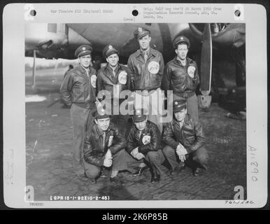 Crew Of The 92Nd Bomb Group Pose Beside Their Boeing B-17 At An Air Base Somewhere In England. 10 February 1945. Stock Photo