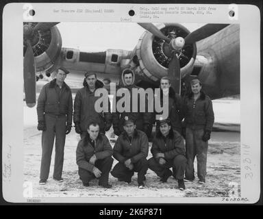 Crew Of The 92Nd Bomb Group Pose Beside Their Boeing B-17 At An Air Base Somewhere In England. 20 January 1945. Stock Photo