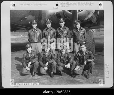 Crew Of The 92Nd Bomb Group Pose Beside Their Boeing B-17 At An Air Base Somewhere In England. 16 March 1945. Stock Photo