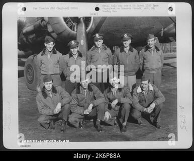 Crew Of The 92Nd Bomb Group Pose Beside Their Boeing B-17 At An Air Base Somewhere In England. 20 February 1945. Stock Photo