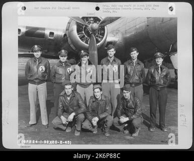 Crew Of The 92Nd Bomb Group Pose Beside Their Boeing B-17 At An Air Base Somewhere In England. 20 February 1945. Stock Photo