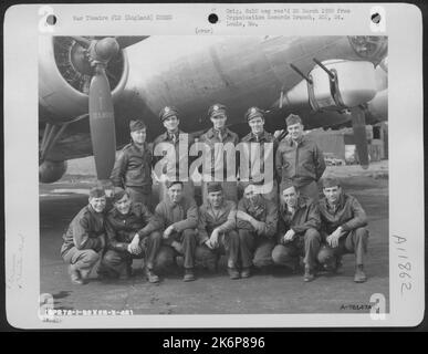 Crew Of The 92Nd Bomb Group Pose Beside Their Boeing B-17 At An Air Base Somewhere In England. 25 March 1945. Stock Photo