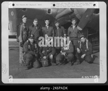 Lt. Wolf And Crew Of The 615Th Bomb Squadron, 401St Bomb Group, Beside A Boeing B-17 'Flying Fortress' At An 8Th Air Force Base In England. 12 April 1945. Stock Photo