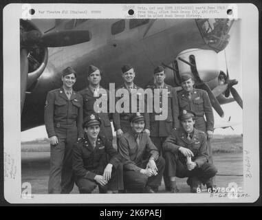 Lt. Gerber And Crew Of The 615Th Bomb Squadron, 401St Bomb Group, Beside A Boeing B-17 'Flying Fortress' At An 8Th Air Force Base In England. 20 April 1945. Stock Photo