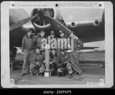 Crew 12 Of The 615Th Bomb Squadron, 401St Bomb Group, Beside A Boeing B-17 'Flying Fortress' At An 8Th Air Force Base In England, 25 March 1945. Stock Photo