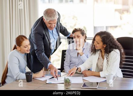 This one right here. a diverse group of businesspeople having a discussion in the office. Stock Photo