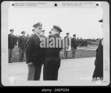 Lt. Gen. Lewis H. Brereton Congratulates A Member Of The 391St Bomb Group On Receiving The Distinguished Flying Cross During A Ceremony At An Air Base In England. 19 July 1944. Stock Photo