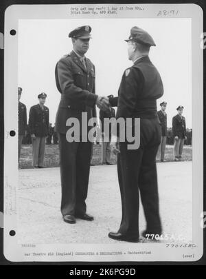 Lt. Gen. Lewis H. Brereton Congratulates A Member Of The 391St Bomb Group On Receiving The Distinguished Flying Cross During A Ceremony At An Air Base In England. 19 July 1944. Stock Photo