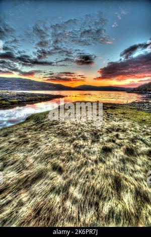 Peninsula of Ardamurchan, Scotland. Artistic sunset view of a river inlet with Loch Sunart in the background. Stock Photo