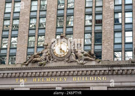 New York City, United States - September 20, 2022. Antique clock, statues and name on the Helmsley Building Stock Photo