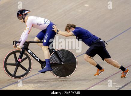 SAINT-QUENTIN-EN-YVELINES - Harrie Lavreysen and national coach Rene Wolff in action in the sprint event during the fourth day of the UCI Track Cycling World Championships. ANP ROBIN VAN LONKHUIJSEN Stock Photo