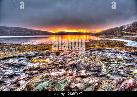 Peninsula of Ardamurchan, Scotland. Artistic sunset view over Loch Sunart, captured from the coastline at Acharacle. Stock Photo