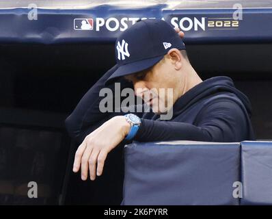 New York City, USA. 14th Oct, 2022. New York Yankees manager Aaron Boone watches the action from the dugout as the Cleveland Guardians take a 4-2 lead in the tenth inning in an American League Division Series game at Yankee Stadium in New York City on Friday, October 14, 2022. Photo by John Angelillo/UPI Credit: UPI/Alamy Live News Stock Photo