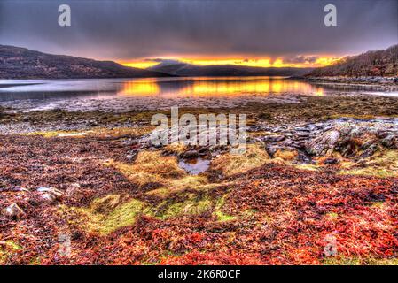 Peninsula of Ardamurchan, Scotland. Artistic sunset view over Loch Sunart, captured from the coastline at Acharacle. Stock Photo