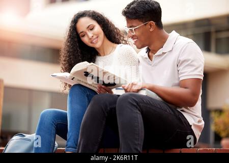 Studying together is better. two young college students at college. Stock Photo