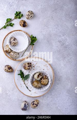 Bowl with quail eggs on light background Stock Photo