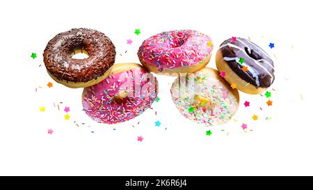 Flying glazed donuts isolated over white background. Stock Photo