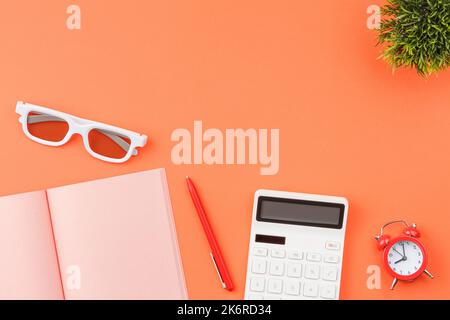 Piggy bank with calculators office desk top view. Stock Photo