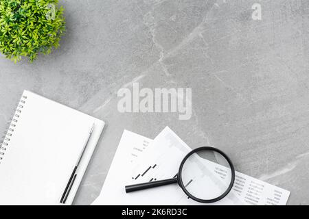Open notepad on gray marble background Stock Photo