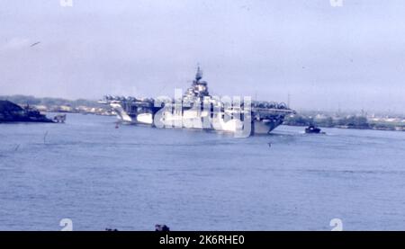 The USS Hornet (CV-12) Leaving Pearl Harbor, Hawaii Photograph taken from the USS Chandeleur (AV-10). Stock Photo