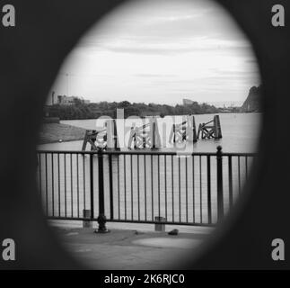 Through the hole - waterfront structures in the bay Stock Photo