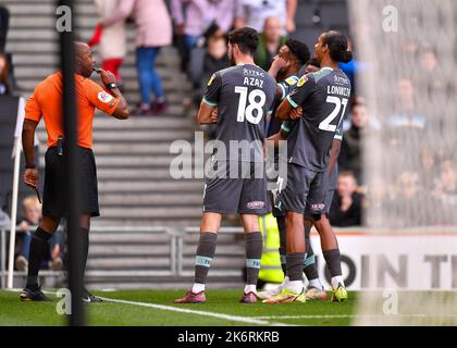 GOAL 0-2 Plymouth Argyle midfielder Finn Azaz (18) Plymouth Argyle defender Nigel Lonwijk (21) and Plymouth Argyle forward Niall Ennis  (11) celebrates a goal  during the Sky Bet League 1 match MK Dons vs Plymouth Argyle at stadium:mk, Milton Keynes, United Kingdom, 15th October 2022  (Photo by Stanley Kasala/News Images) Stock Photo