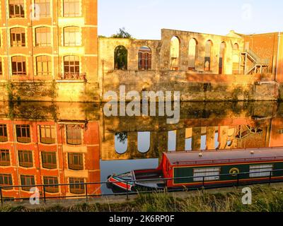 Riverside view of the old industrial buildings that are now offices and flats along side the River Avon, United Kingdom. Stock Photo