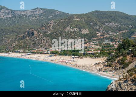 Oludeniz, Mugla, Turkey – August 22, 2021. View over the Belcekiz beach in Oludeniz resort in the Fethiye district of Mugla province of Turkey. Stock Photo