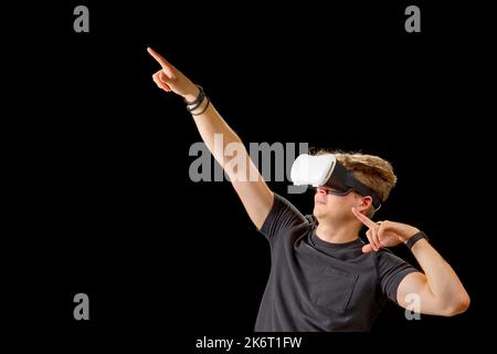Portrait of a young man with 3D virtual reality glasses. Young man using vr headset, VR goggles Stock Photo