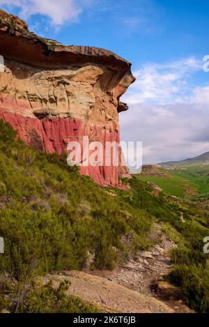 A rocky hiking trail leading past the cliffs of Mushroom Rock in the Golden Gate Highlands National Park. This is a nature reserve near the popular to Stock Photo