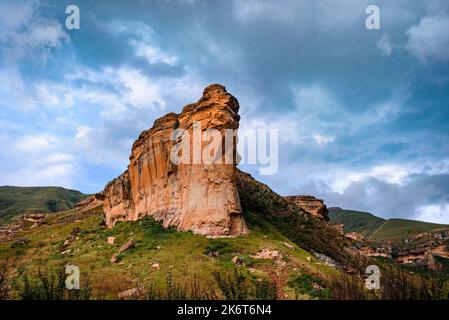 The Brandwag Buttress (Sentinel) lit up at sunset in Golden Gate Highlands National Park. This is a nature reserve near the popular town of Clarens in Stock Photo