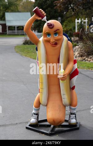 Hot dog statue pouring ketchup on itself Stock Photo