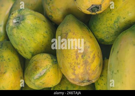 Photography of yellow green fresh fruits on the Australian market. The papaya are fresh and ripe Stock Photo