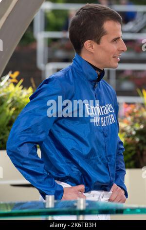 Ascot, Berkshire, UK. 15th October, 2022. William Buick realised a long-held ambition at Ascot today as he was crowned Champion Jockey for the first time. Racing legend Willie Carson presented him with the trophy. The 34-year-old has dominated the championship from the outset and begins the final day of the season on 157 winners, 67 clear of his closest challengers Hollie Doyle and Tom Marquand. Credit: Maureen McLean/Alamy Live News Stock Photo