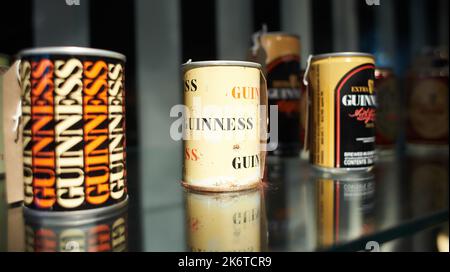 Dublin  Ireland - 08 31 2022: Old historical bottles of beer in the museum of Guinness Storehouse. Stock Photo