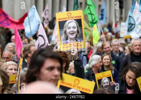 London, UK. 14th Oct, 2022. A protester holds a picture of British Prime minister Liz Truss as hundreds of Extinction Rebellion protesters demonstrate in Westminster against climate change crisis and rising energy bills. (Photo by Steve Taylor/SOPA Images/Sipa USA) Credit: Sipa USA/Alamy Live News Stock Photo