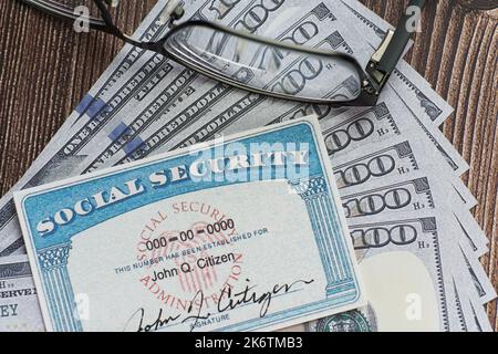Lake Elsinore, CA, USA - October 15, 2022: Fake Social security card on prop US currency Stock Photo