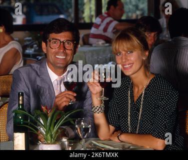 Couple in pub drinking red wine Stock Photo