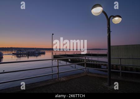 Germany, Berlin, 02. 03. 2021, Grosser Wannsee, sunset, at the harbour, lantern, lamp, excursion boat, ferry Stock Photo