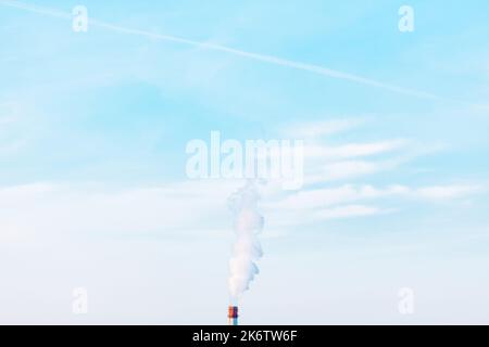 Exhaust industrial smoke from factory pipe . Climate change concept . Smoke at blue sky Stock Photo