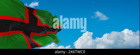 flag of Baltic Finns Karelians at cloudy sky background, panoramic view. flag representing ethnic group or culture, regional authorities. copy space f Stock Photo