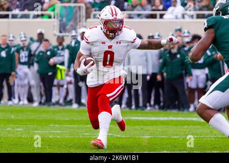 Wisconsin running back Braelon Allen (0) is brought down by Iowa ...