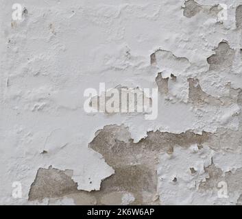 Background of peeling white paint on an old wall.  Stock Photo
