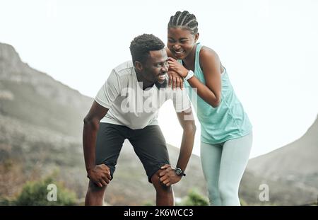 Taking break to catch our breath. a young couple taking a break during a workout. Stock Photo