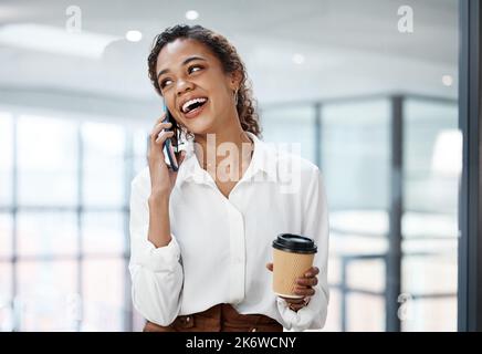 Im glad we got in touch. an attractive young businesswoman making a phonecall while working in her office. Stock Photo