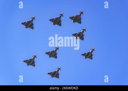 Group of supersonic planes in formation flying in the sky in a military parade. Stock Photo